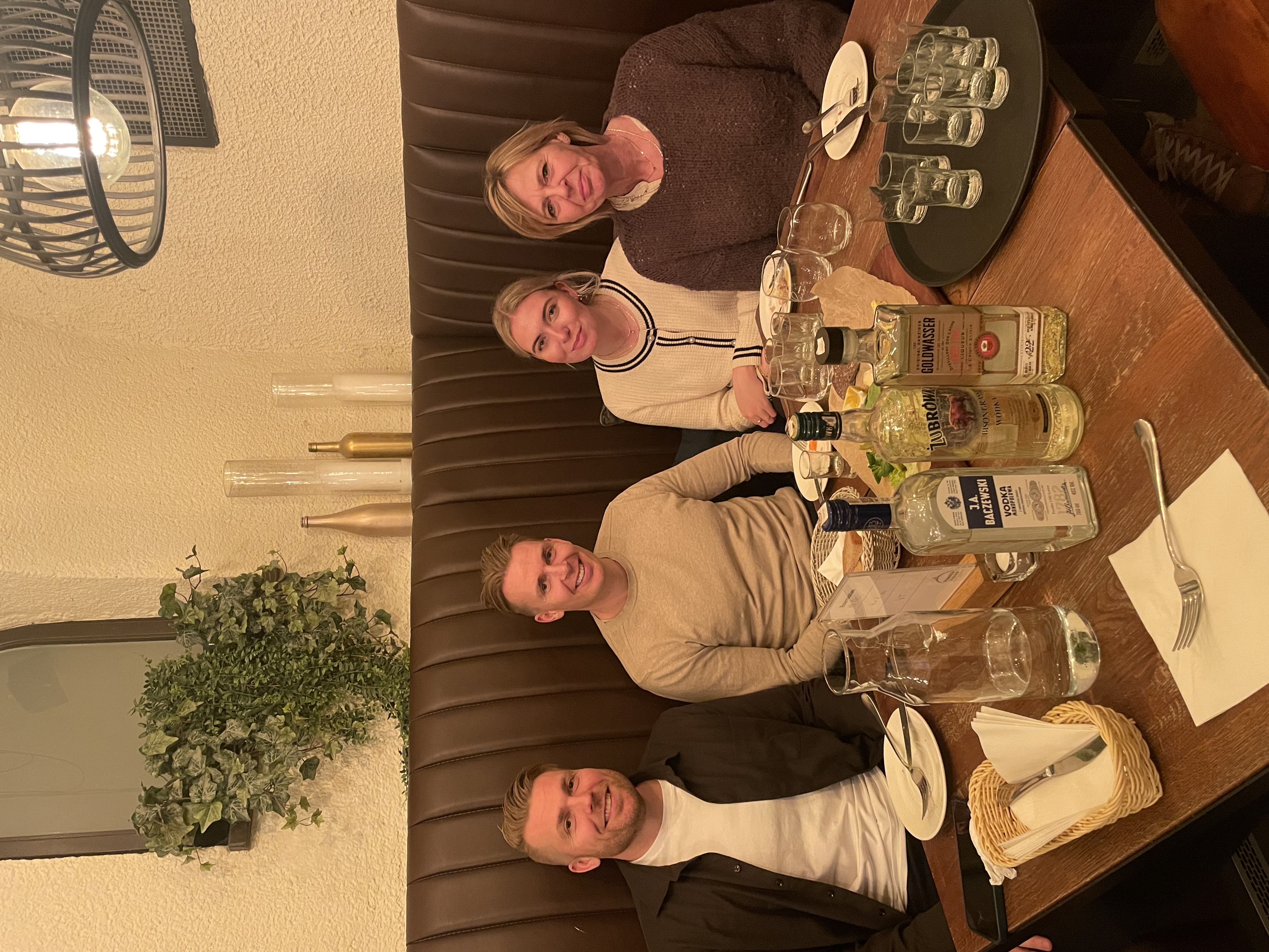 Guests sharing a relaxed Polish vodka tasting at a central city venue